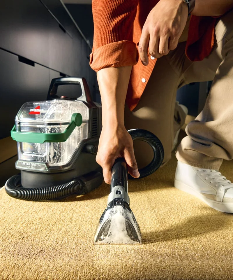 BISSELL Little Green Pet Pro 3909 cleaning carpet with its hose-mounted hand tool